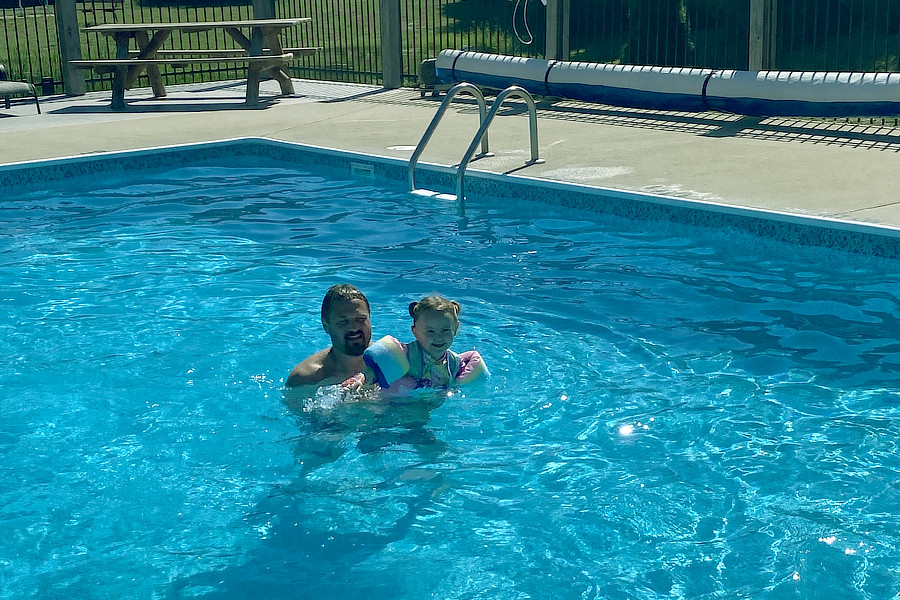 Father daughter swimming pool